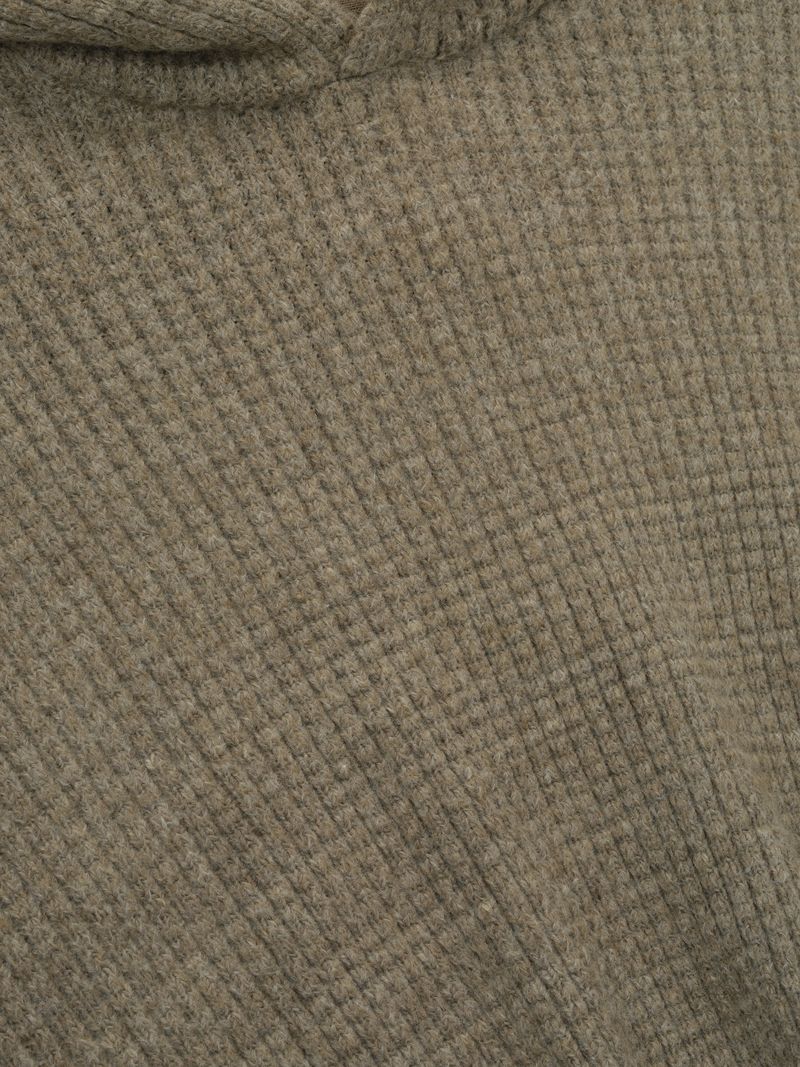 Close-up of olive green Heavy Waffle 90s Hoodie highlighting textured waffle knit fabric detail