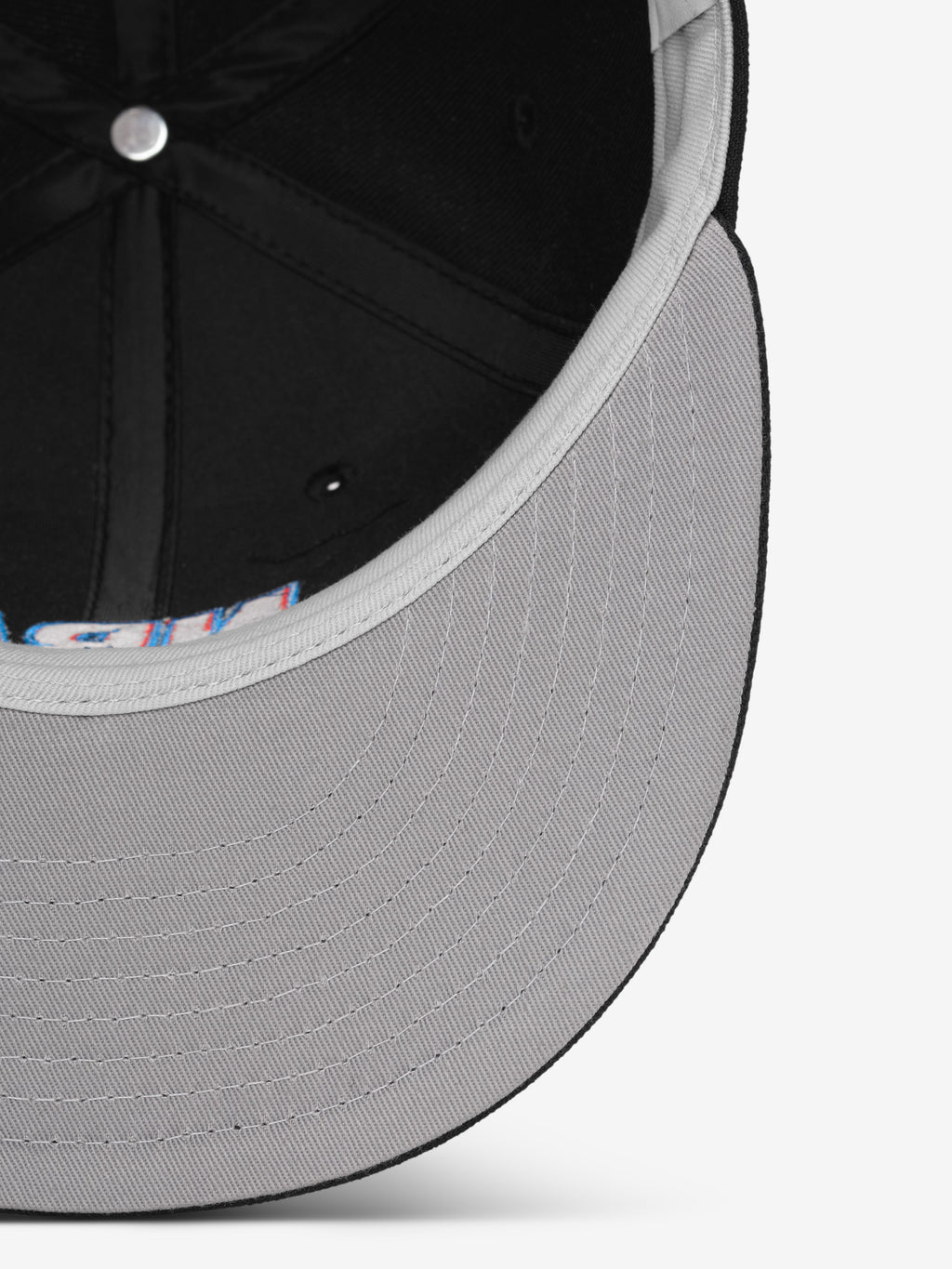 Close-up of a gray cap with a patterned interior on a white background