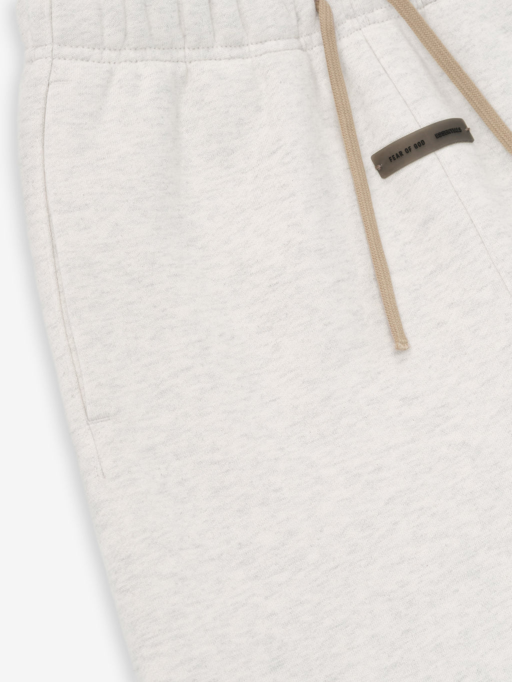Close-up of oatmeal heather Kids Classic Sweatpant pocket and beige drawstring with small black logo patch, gallery position 0