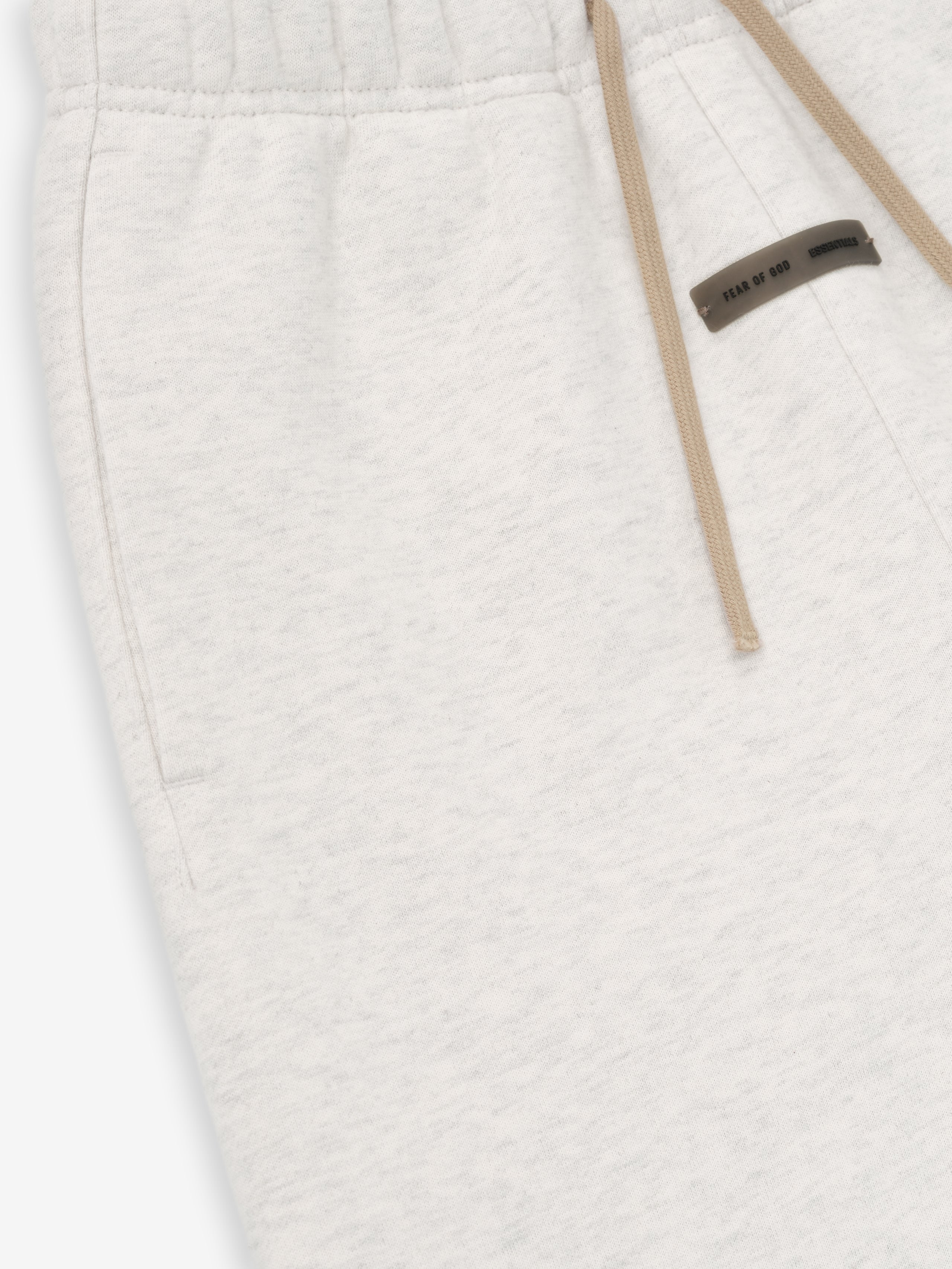 Close-up of oatmeal heather Kids Classic Sweatpant pocket and beige drawstring with small black logo patch, gallery position 0