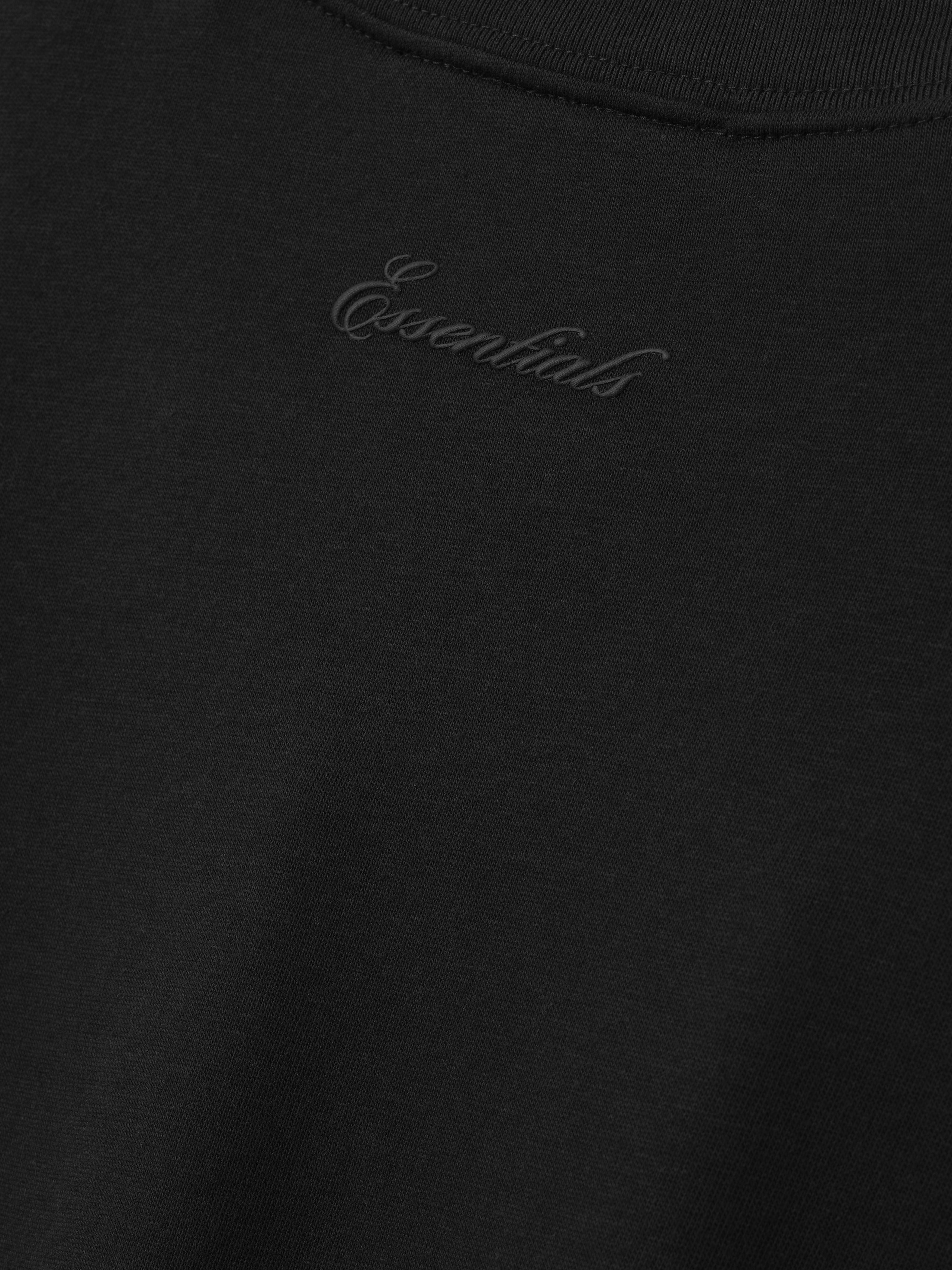 Black t-shirt with 'Essentials' signature logo 