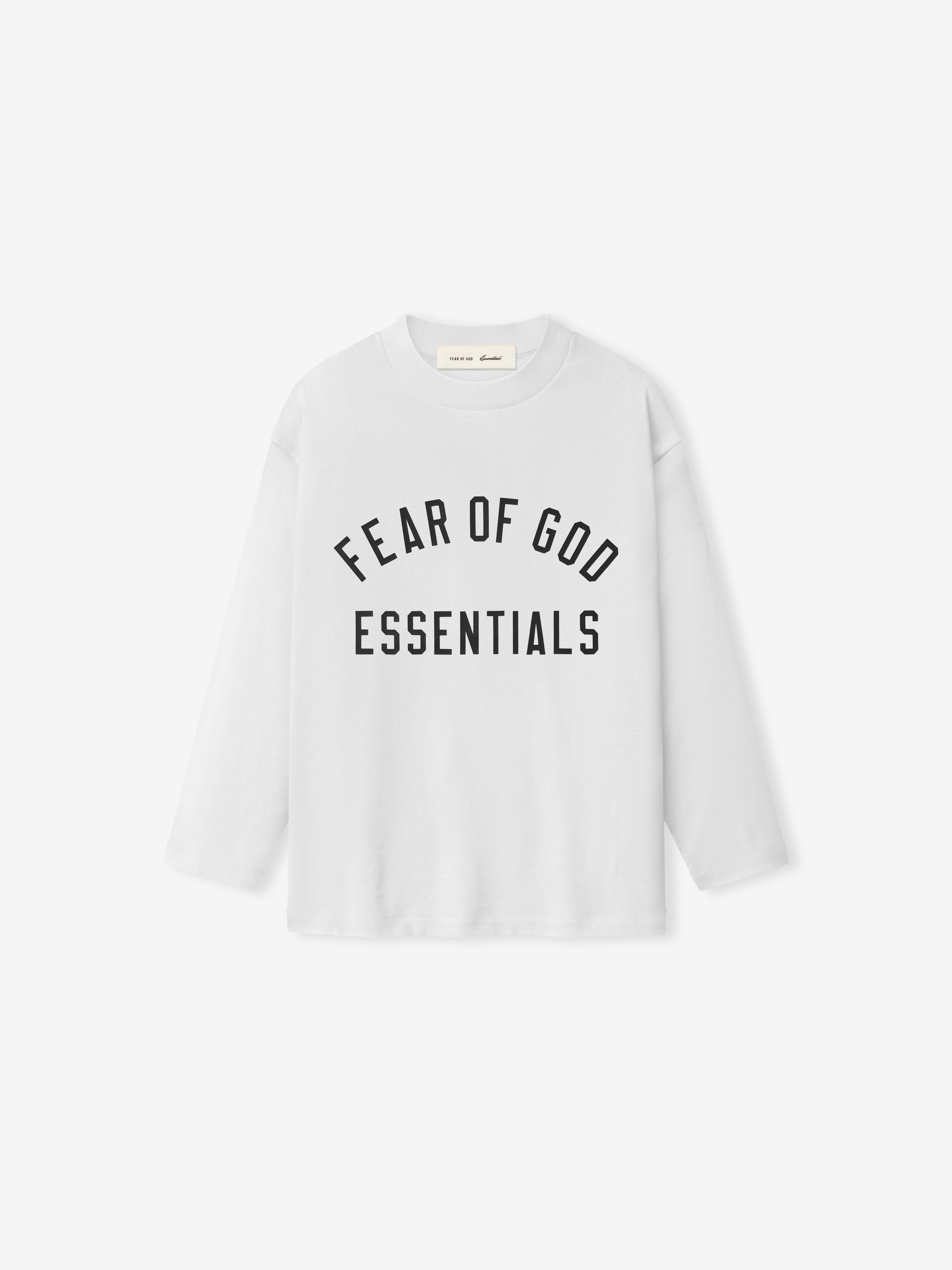 front view of kids classic long sleeve tee in white cotton jersey with Fear of God Essentials chest logo print