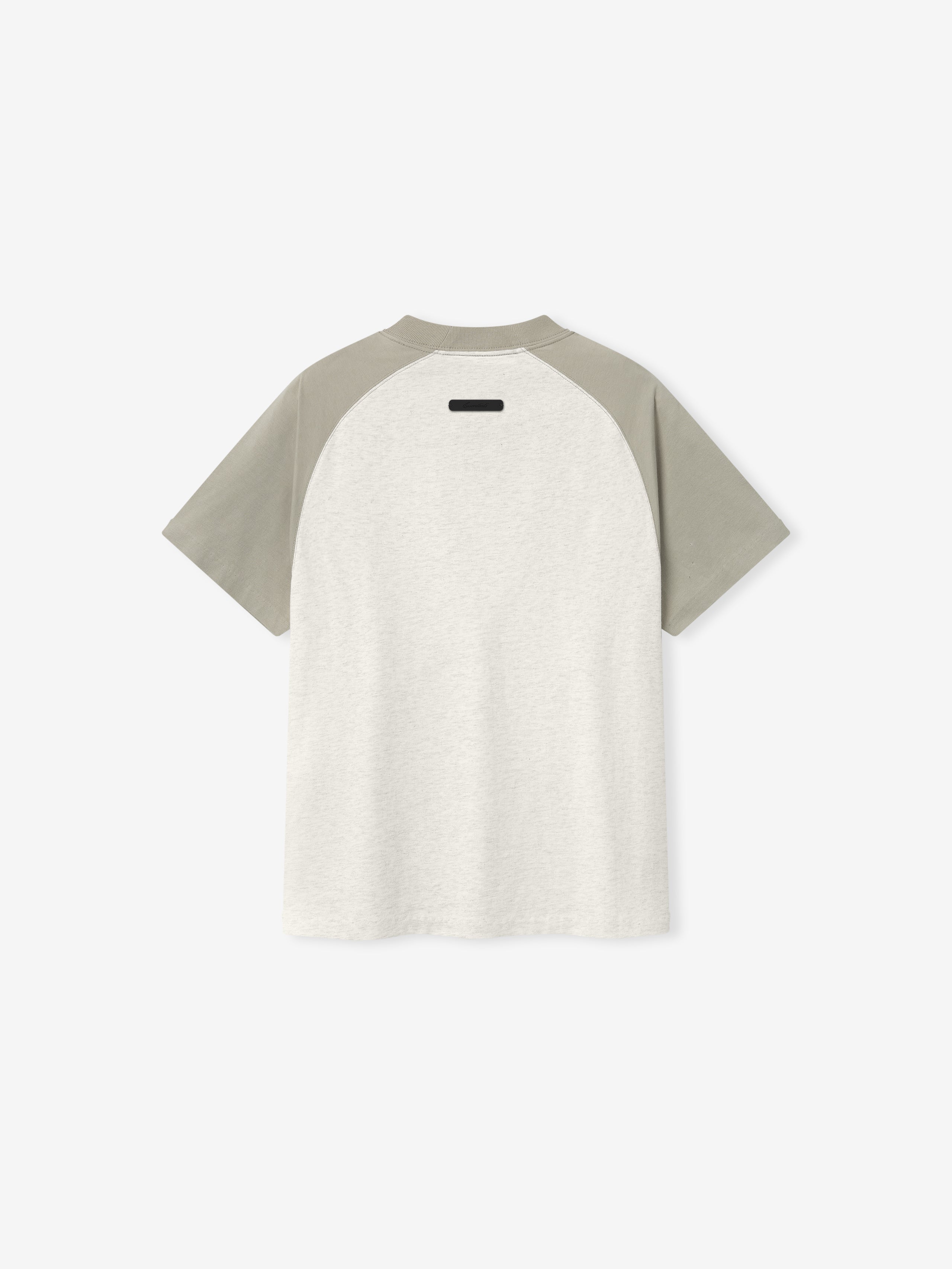 Baseball t-shirt with gray sleeves and white body on a light beige background