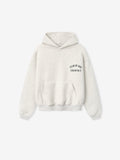 light beige kids hoodie with front pouch pocket and Fear of God Essentials logo printed on chest
