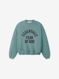 Teal crewneck sweatshirt with black "ESSENTIALS FEAR OF GOD" text printed in an arched layout on front panel