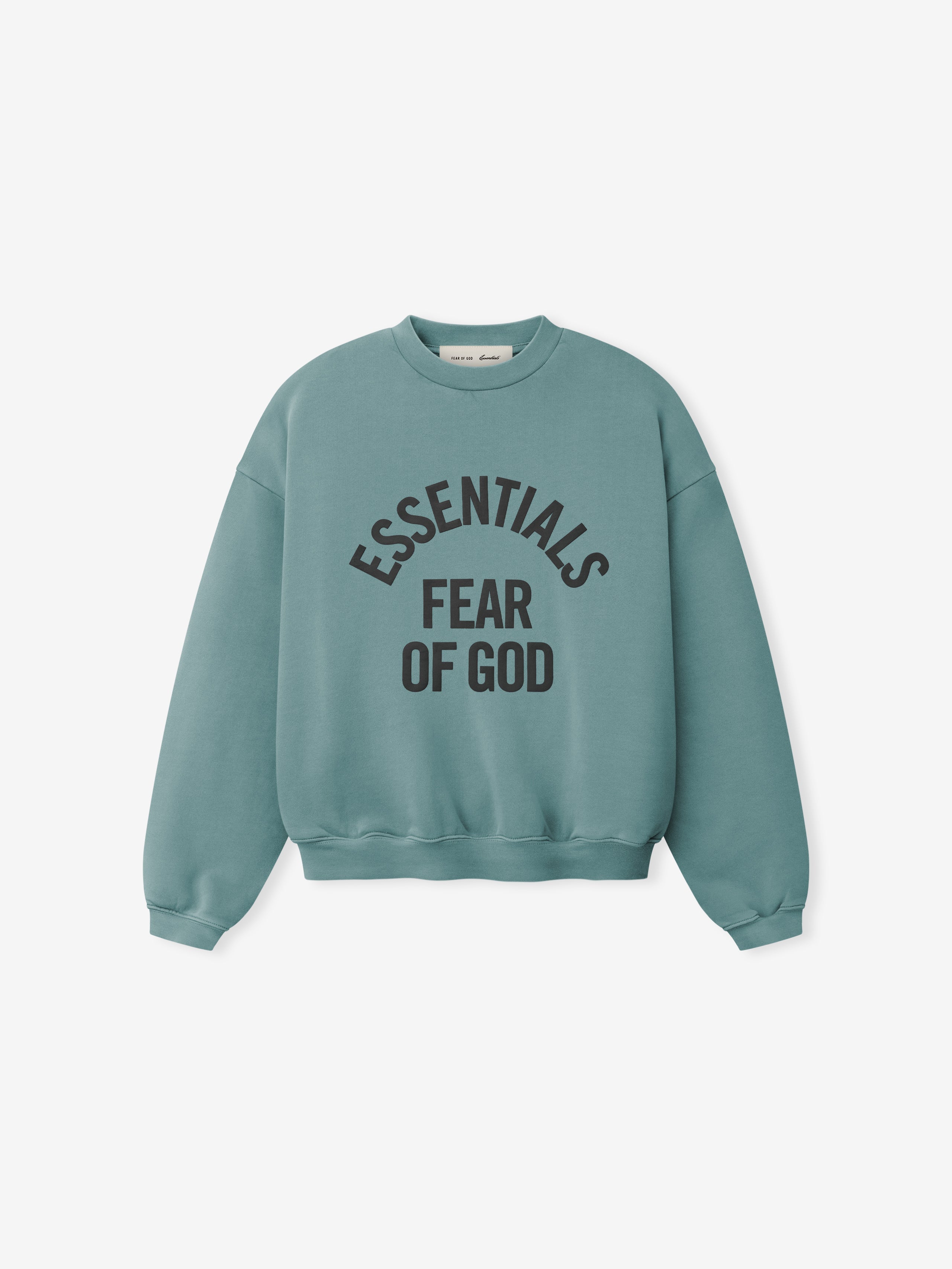 Teal crewneck sweatshirt with black "ESSENTIALS FEAR OF GOD" text printed in an arched layout on front panel