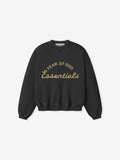 front view of black kids crewneck sweatshirt with Fear of God Essentials logo printed in tan text on chest