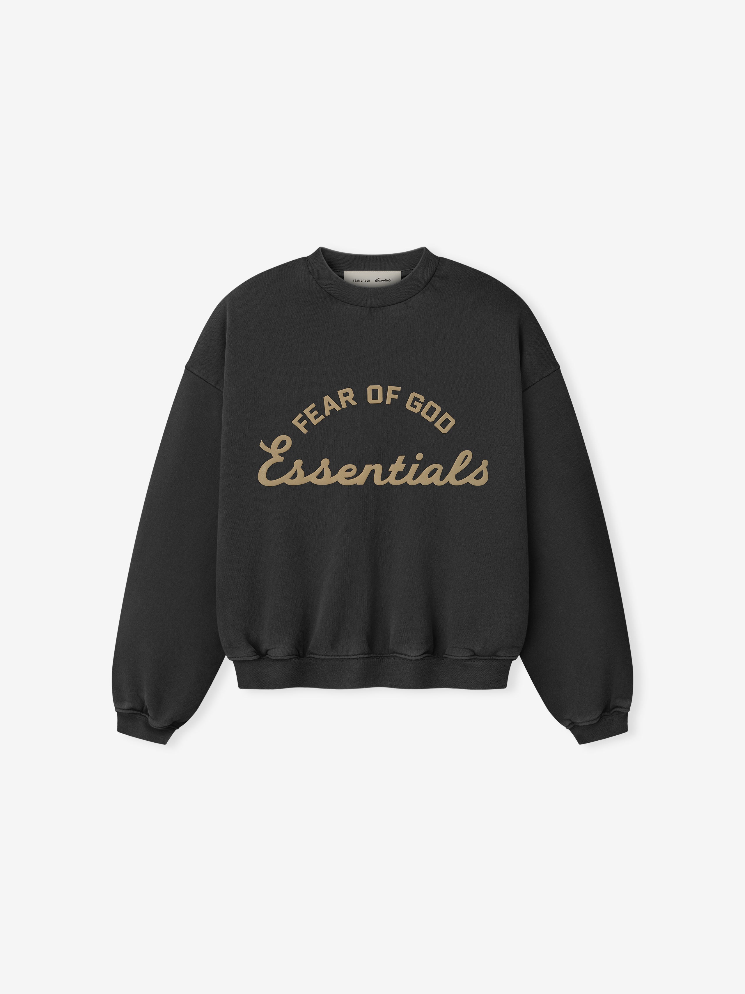 front view of black kids crewneck sweatshirt with Fear of God Essentials logo printed in tan text on chest