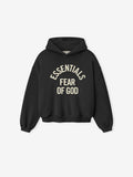 black cropped kids hoodie with cream Essentials Fear of God text printed in arched design on front