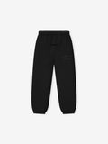 black kids classic sweatpants with elastic waistband and subtle tonal Fear of God Essentials logo on thigh