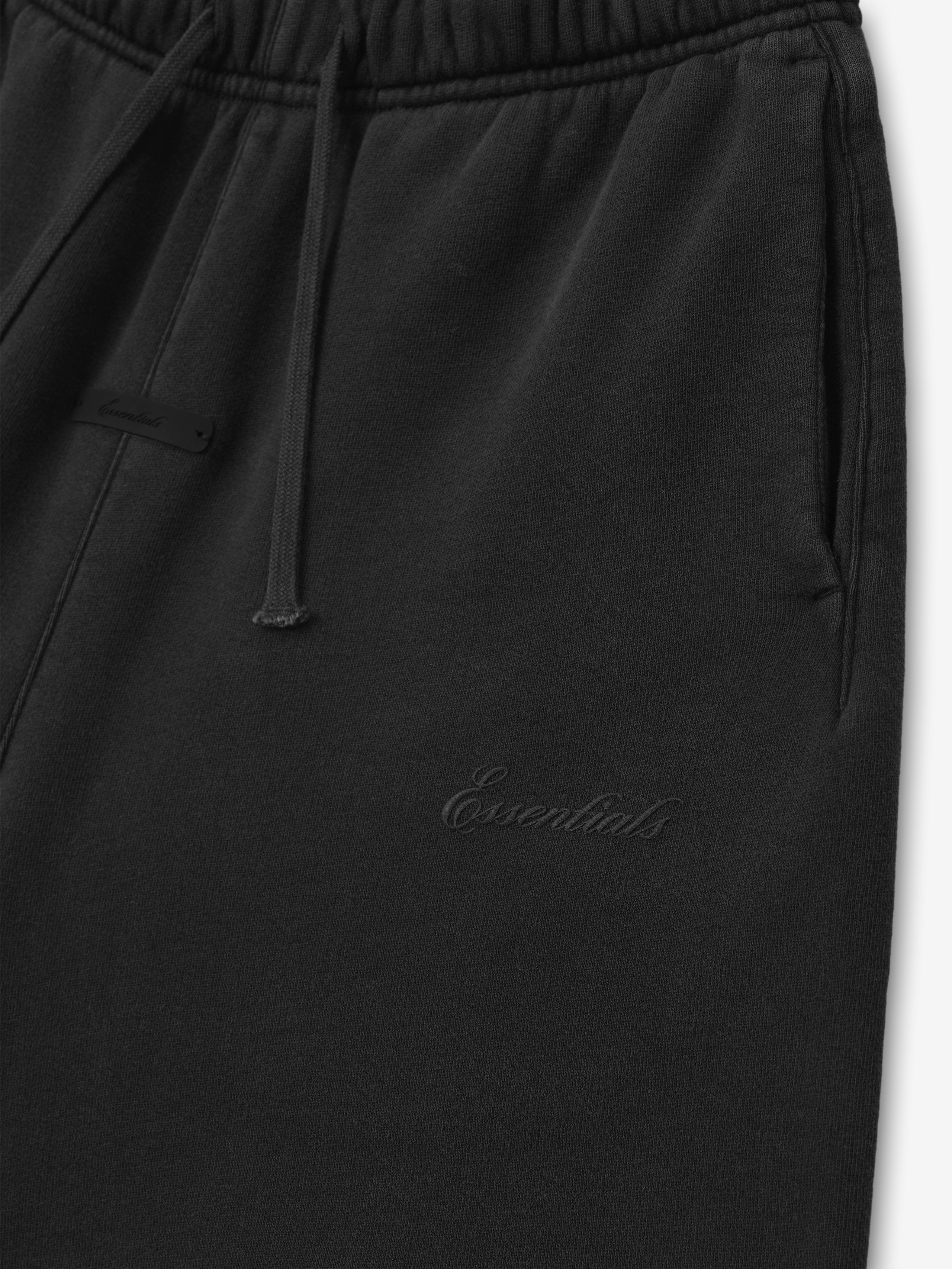 black kids mid-length sweatshort in heavy cotton fleece with elastic waistband, drawstring, side pockets, and tonal Essentials logo embroidery