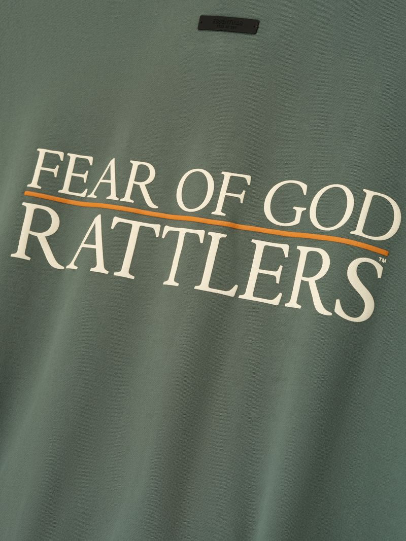 Close-up of olive green FAMU Sport Crewneck featuring white "FEAR OF GOD RATTLERS" text with orange underline, file DnyQdng.jpg