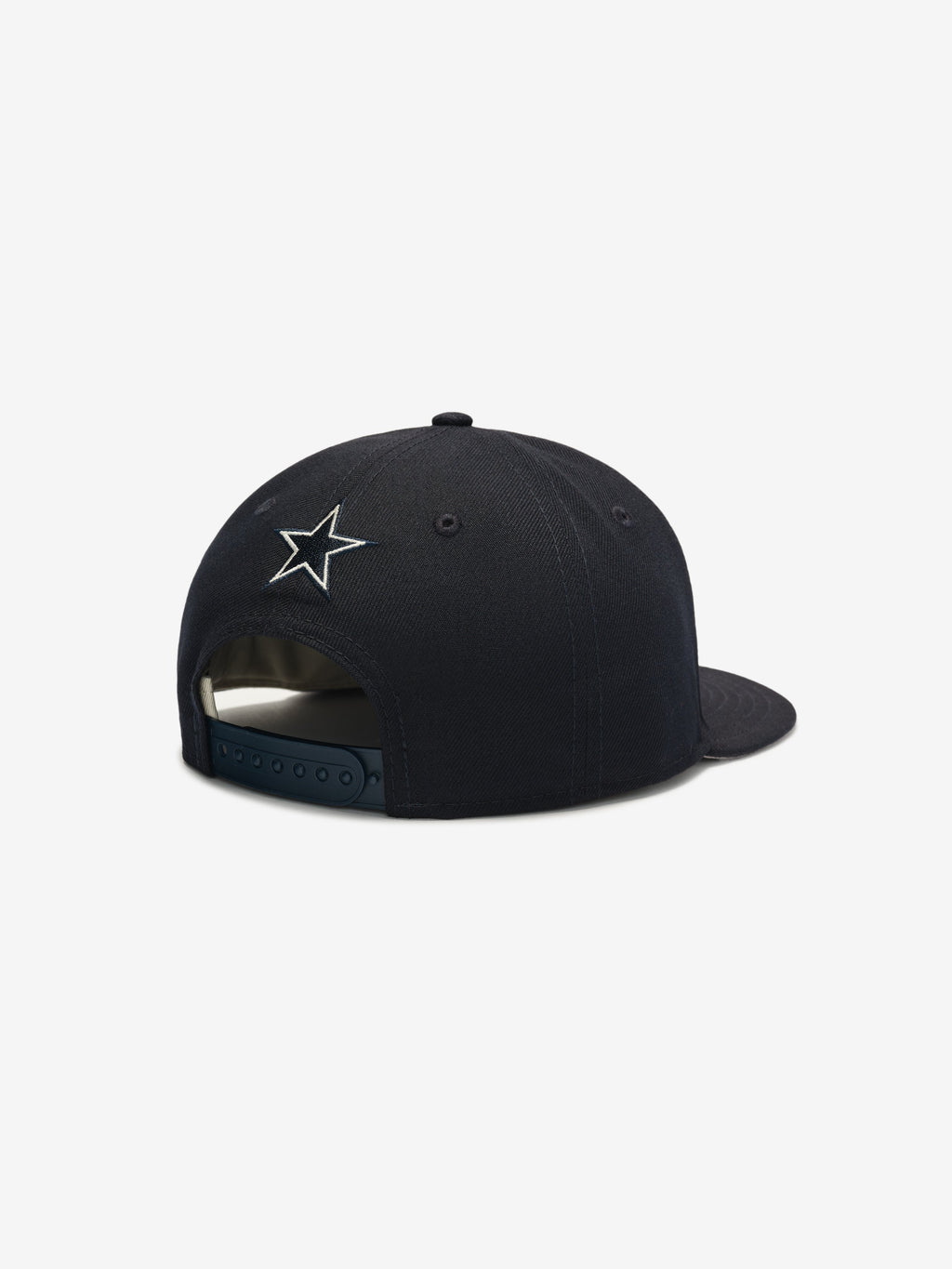 Rear angle of navy Cowboys 9Fifty RC Snapback highlighting embroidered star logo and adjustable snap closure, gallery image 0