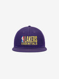 Front view of purple Lakers 9Fifty RC Snapback with flat brim and yellow embroidered Lakers Essentials logo