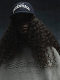 Low-lit front view of navy Cowboys 9Fifty RC Snapback with bold white Dallas Essentials embroidery, gallery image 0
