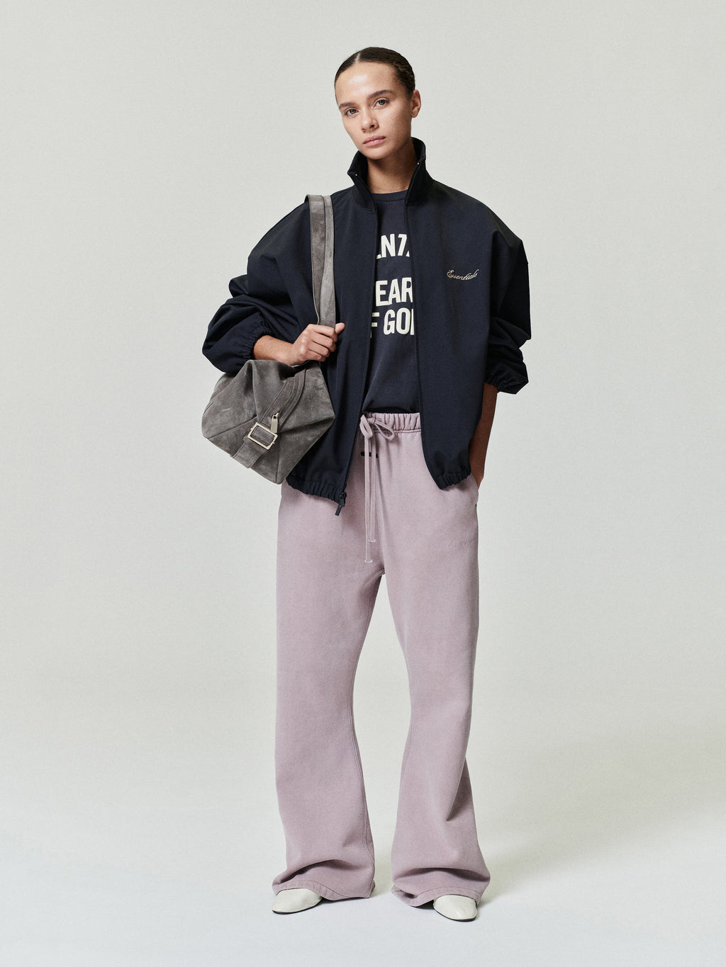 woman wearing relaxed fit flare sweatpants in vintage pigment-dyed cotton fleece with elastic drawstring waist