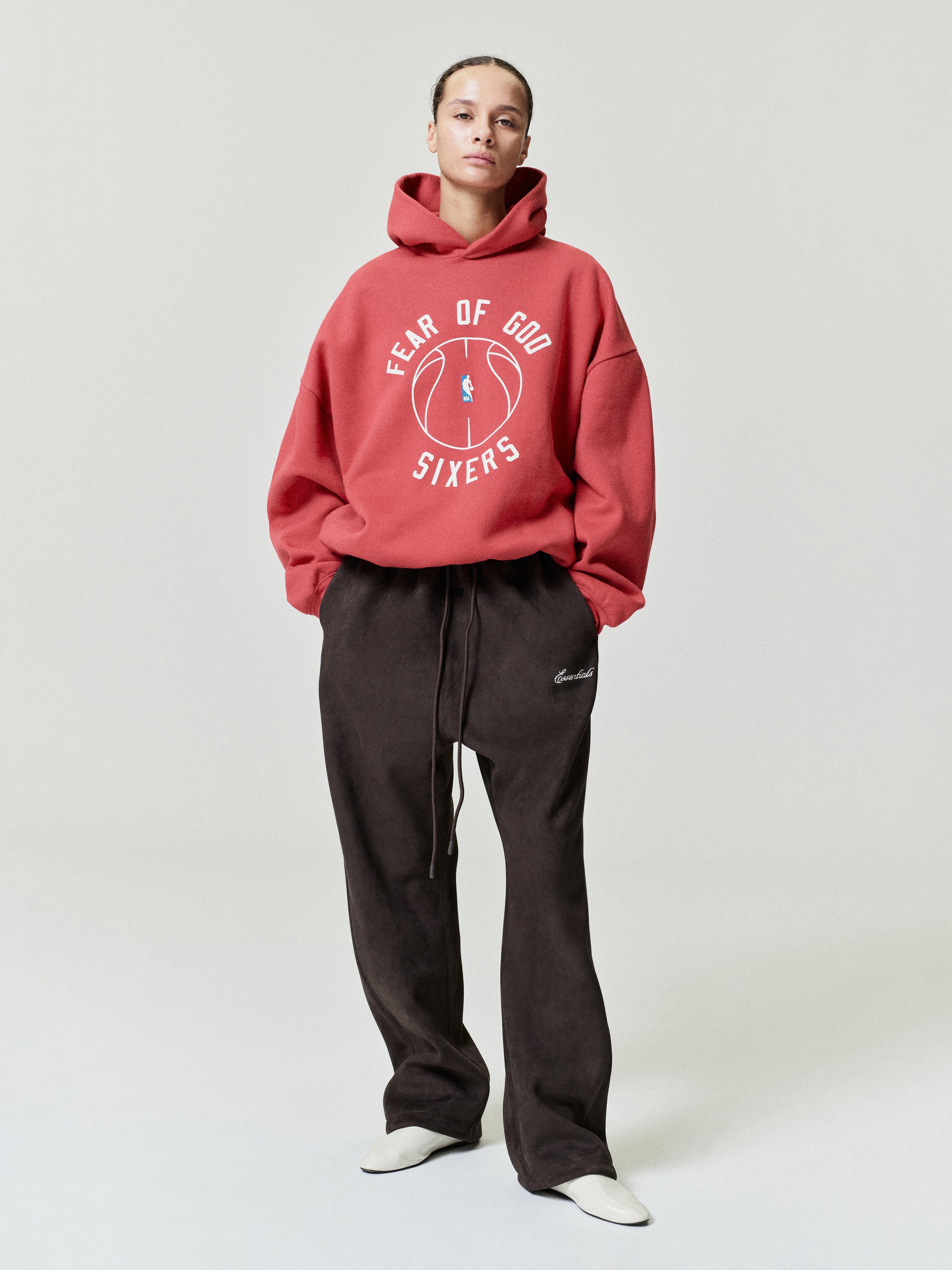 red heavyweight hoodie with puff-printed FEAR OF GOD SIXERS text and basketball graphic on front center