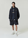 black heavyweight cotton fleece sweatshorts with relaxed fit and embroidered Essentials signature logo on left leg