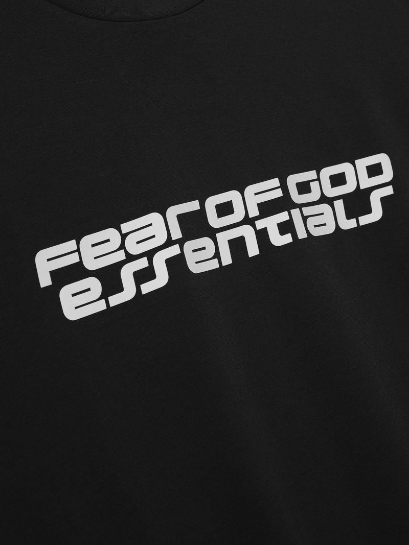 Close-up of black Ponte 90s Tee showing angled light grey Fear of God Essentials logo on front, gallery image UIBT5zHg.jpg