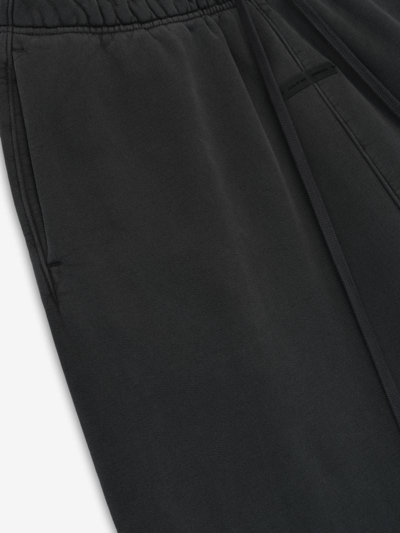 Close-up of black Heavy Fleece Flare Sweatpant showing drawstring waistband and side pocket detail, gallery 0, file V38nx8Xw.jpg