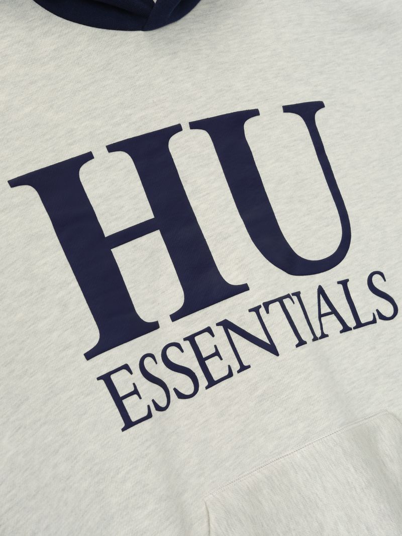 Close-up of light gray Howard University Sport Hoodie with large navy HU Essentials text, file XphlG_ZQ.jpg gallery image 0