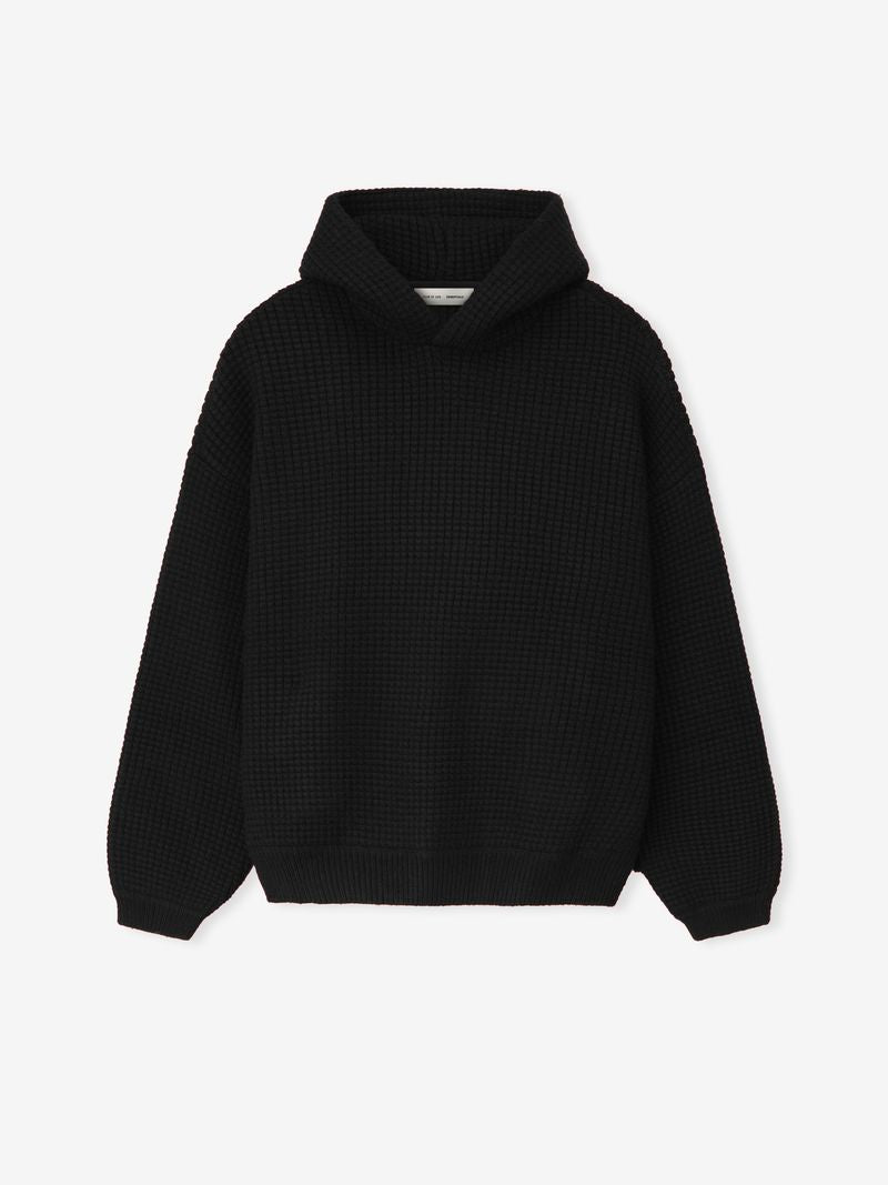 Black Heavy Waffle 90s Hoodie shown flat front view highlighting waffle knit texture and hood on white background